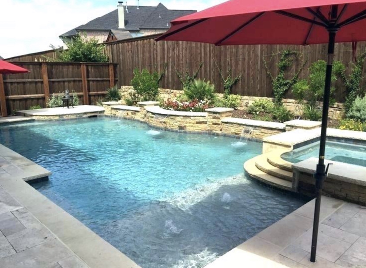 inground swimming pools with a red umbrella and a hot tub in Midlothian.