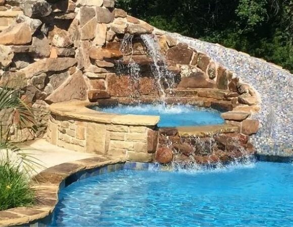 small pool with waterfall designed by Pool Builder, Pool Installation, Pool Remodel, Outdoor Kitchen in DeSoto, TX